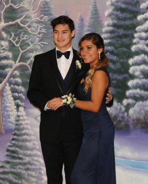 Dominic Decastro and Cynthia Moreno pose for photos Saturday night in the Lemoore Event Center.